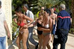 Tourists are evacuated after a gunman opened fire on a beachside hotel in Sousse