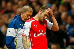 Football: Arsenal's Jack Wilshere looks dejected as he is substituted