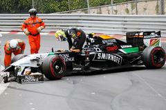 Force India Formula One driver Sergio Perez leaves his car after crashing at the start of the Monaco F1 Grand Prix in Monaco