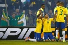 Brazil's Silva celebrates with teammates Robinho and Miranda after scoring a goal against Venezuela during their first round Copa America 2015 soccer match at Estadio Monumental David Arellano in Sant