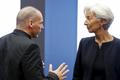 Greek Finance Minister Varoufakis talks to IMF Managing Director Lagarde during an euro zone finance ministers meeting in Luxembourg