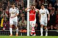 Football: Arsenal's Santi Cazorla looks dejected after missing a chance to score
