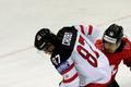 Canada's Crosby fights for the puck with Switzerland's Blum during their Ice Hockey World Championship game at the O2 arena in Prague