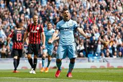 Football: Sergio Aguero celebrates after scoring the fourth goal for Manchester City and completing his hat trick