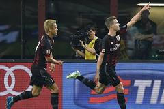 AC Milan's van Ginkel celebrates after scoring a goal against AS Roma during their Serie A soccer match at the San Siro stadium in Milan