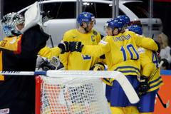 Sweden's Moller celebrates scoring a goal with team mates during their Ice Hockey World Championship game against Germany in Prague
