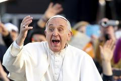 Pope Francis waves as he leaves at the end of meeting with youths at the seafront during his pastoral visit in Naples