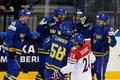 Sweden's Kronwall celebrates with team mates his goal against the Czech Republic during their Ice Hockey World Championship game at O2 arena in Prague