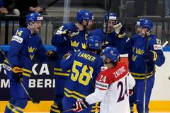 Sweden's Kronwall celebrates with team mates his goal against the Czech Republic during their Ice Hockey World Championship game at O2 arena in Prague