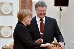 Angela Merkelová a Petro Porošenko v Minsku.