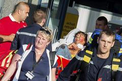French emergency services transport a victim after a shooting on the Amsterdam to Paris Thalys high-speed train in Arras