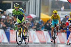 Tinkoff-Saxo team rider Contador of Spain climbs to the finish line ahead of Astana team rider Nibali of Italy during the 161-km (100 miles) eighth stage of the Tour de France cycling race