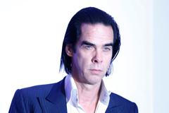 Singer Nick Cave arrives for a gala screening of '20,000 Days on Earth' at the Barbican in London