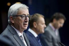 EU Commission President Juncker, EU Council President Tusk and Eurogroup President Dijsselbloem address a joint news conference after an euro zone leaders summit in Brussels