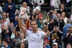 Richard Gasquet of France celebrates after winning his match against Stan Wawrinka of Switzerland at the Wimbledon Tennis Championships in London