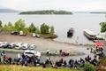 Youths stand in a line to wait for the MS Thorbjorn ferry to take them to Utoya island