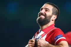 Atletico's Turan reacts at the end of their Champions League semi-final second leg soccer match at Stamford Bridge against Chelsea in London