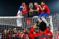 Chile celebrates with the trophy on the goal after defeating Argentina to win the Copa America 2015 final soccer match at the National Stadium in Santiago