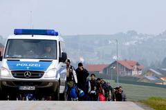 Uprchlíci na německo-rakouské hranici.