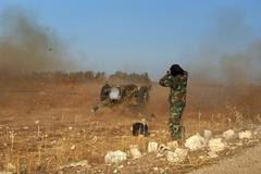 Syrská svobodná armáda bojující s vládními jednotkami prezidenta Asada.