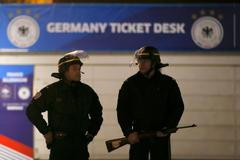 Police stand outside the Stade de France soccer stadium where explosions were reported during the France vs German friendly match