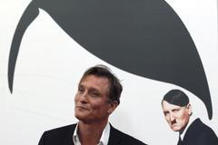 Hitler film Actor Oliver Masucci arrives on the red carpet at the world premier of the film 'Look Who's Back' in Berlin