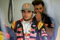 Toro Rosso Formula One driver Carlos Sainz of Spain walks in the team garage during the third practice session of the Australian F1 Grand Prix at the Albert Park circuit in Melbourne