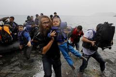 Uprchlíci po vylodění na řeckém ostrově Lesbos.