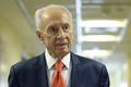 Former Israeli President Peres delivers a statement to the media as he is discharged from a hospital near Tel Aviv
