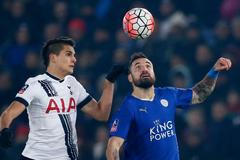 Tottenham's Erik Lamela in action with Leicester City's Marcin Wasilewski