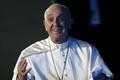 Pope Francis gestures after his arrival in Mexico City
