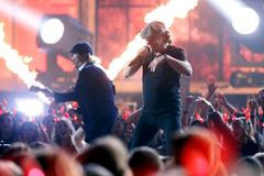 Johnson and Young of AC/DC perform a medley of songs to open the show at the 57th annual Grammy Awards in Los Angeles