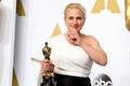Patricia Arquette, best supporting actress winner for her role in the film "boyhood," poses with her award in Hollywood,