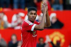 Manchester United's Marcus Rashford applauds their fans after the match