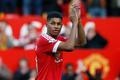 Manchester United's Marcus Rashford applauds their fans after the match