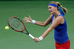 Czech Republic's Petra Kvitova returns a ball to Germany's Andrea Petkovic during their final match of the Fed Cup tennis tournament in Prague