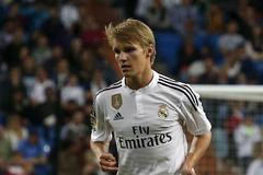 Real Madrid's Martin Odegaard controls the ball during their Spanish first division soccer match against Getafe at Santiago Bernabeu stadium in Madrid