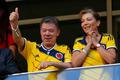 Colombia's President Santos and his wife gesture during the team's 2014 World Cup Group C soccer match against Ivory Coast in Brasilia