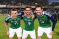 Northern Ireland's Conor Washington, William Grigg and Kyle Lafferty pose for photos before they leave for Euro 2016