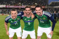 Northern Ireland's Conor Washington, William Grigg and Kyle Lafferty pose for photos before they leave for Euro 2016