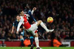 Manchester City's Wilfried Bony in action with Arsenal's Laurent Koscielny