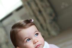 Britain's Princess Charlotte poses for a photograph in this undated photograph taken by her mother, Catherine, Duchess of Cambridge, at Anmer Hall in Norfolk