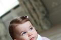 Britain's Princess Charlotte poses for a photograph in this undated photograph taken by her mother, Catherine, Duchess of Cambridge, at Anmer Hall in Norfolk
