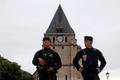 French CRS police stand guartd in front of the church a day after a hostage-taking in Saint-Etienne-du-Rouvray near Rouen in Normandy
