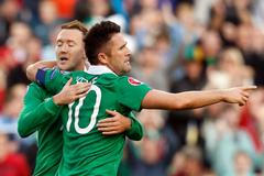 Ireland's Keane is congratulated by McGeady after scoring against Gibraltar during their Euro 2016 qualifying match in Dublin