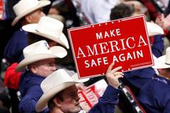 A delegate from Texas holds up a sign at the Republican National Convention in Cleveland