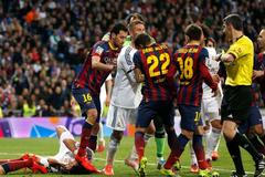 Barcelona's Busquets steps on Real Madrid's Pepe after a Messi goal against Real Madrid during La Liga's second 'Clasico' soccer match of the season in Madrid