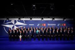 NATO heads of state and other leaders participate in a family photo at the NATO Summit in Warsaw, Poland