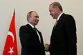 Russian President Putin shakes hands with Turkish President Erdogan during their meeting in St. Petersburg
