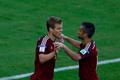 Russia's Kokorin celebrates with Samedov after scoring a goal against Algeria during their 2014 World Cup Group H soccer match at the Baixada arena in Curitiba